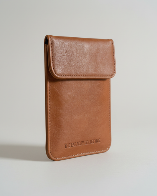 Brown leather look pouch with branding on a light gray background. Blocks RFID, EMF, wireless signals and more